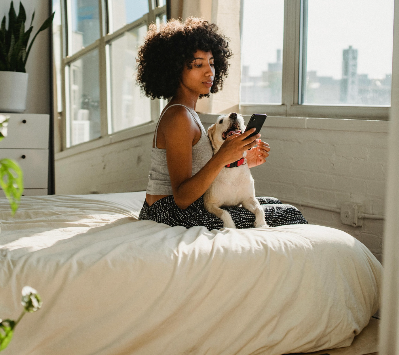 Black woman using Lumia iphone app to self-manage symptoms